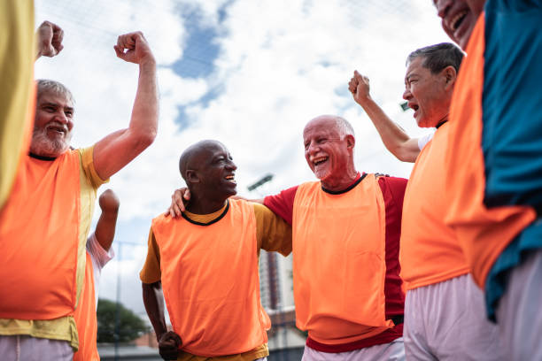 istock Senior men celebrating on the soccer field 1398520610