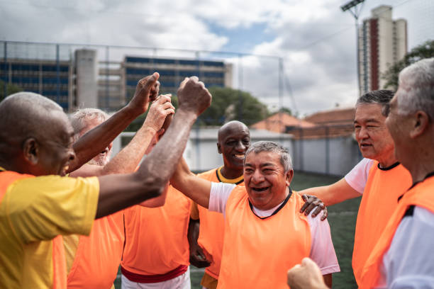 istock Senior men celebrating on the soccer field 1398520637