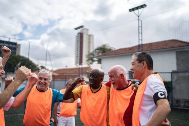 istock Senior men celebrating on the soccer field 1398520643