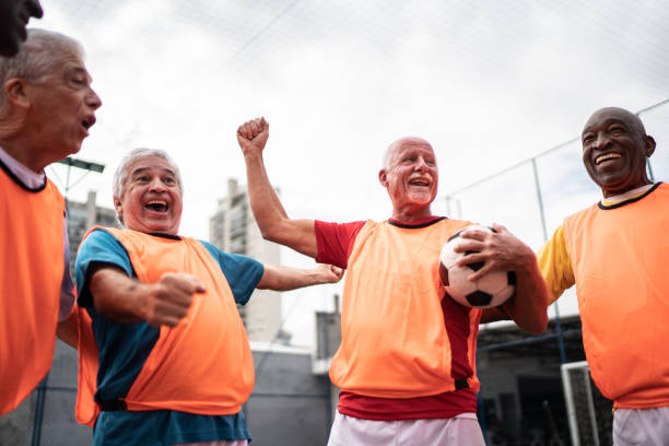 istock Senior men celebrating on the soccer field 1398520925