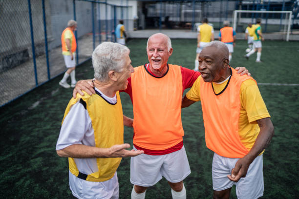 istock Senior men talking on the soccer field 1398521590