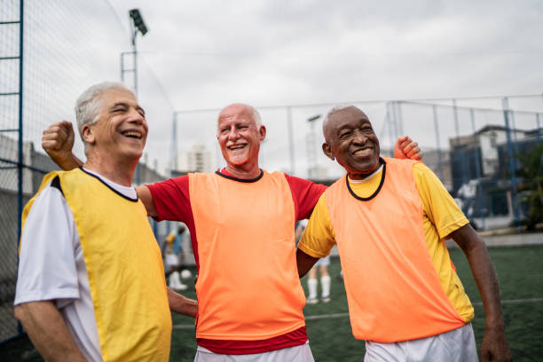 istock Senior men embracing on the soccer field 1398521593