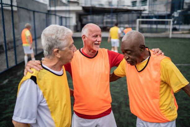 istock Senior men talking on the soccer field 1398521598