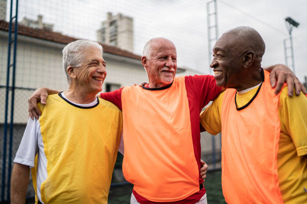 istock Senior men embracing on the soccer field 1398521604