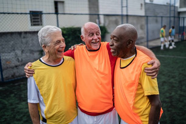 istock Senior men embracing on the soccer field 1398521609