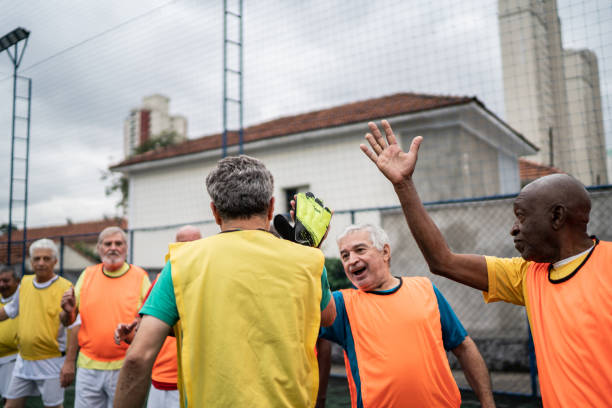 istock Men doing high-five before a match on the soccer field 1398521611
