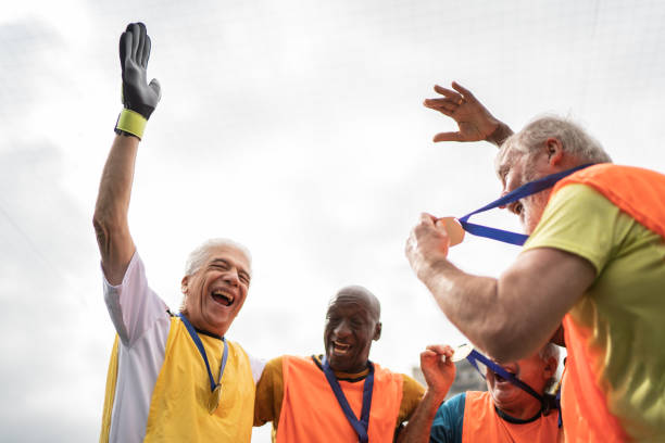 istock Men celebrating winning a match on the soccer field 1398521668