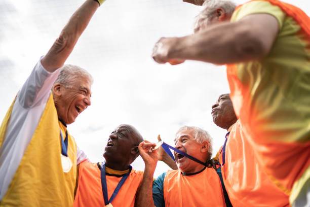 istock Men celebrating winning a match on the soccer field 1398521672