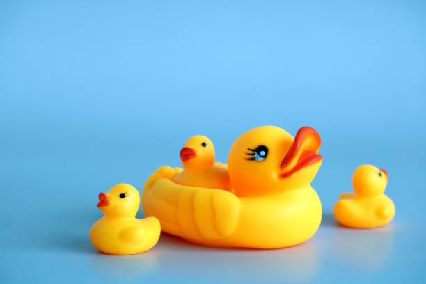 istock rubber duck with ducklings on a blue. 1398526261