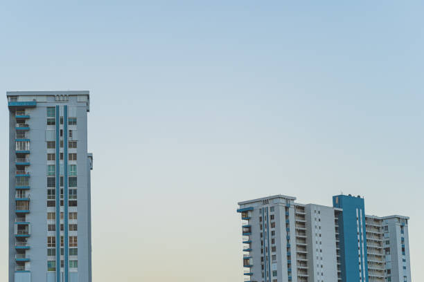 istock High-rise condominiums against clear blue sky 1398527251