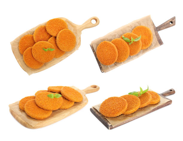 Set with tasty fried breaded cutlets on white background