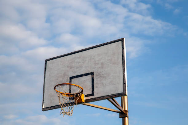 istock old basketball shield and basketball hoop 1398540152