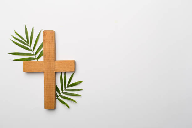 istock Palm branches and cross on white background, top view. Palm Sunday concept 1398544031