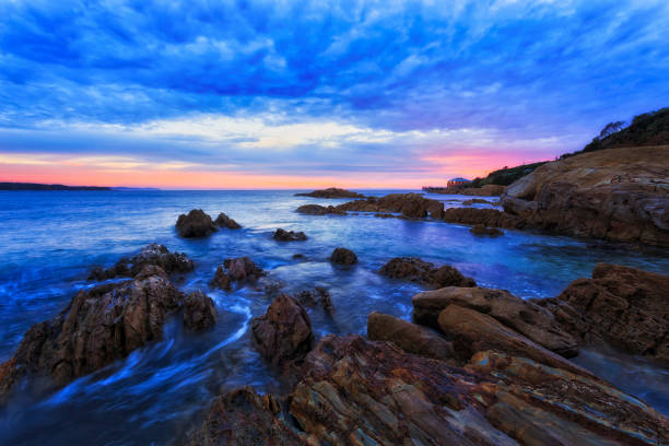 istock Tathra Rocks low edge red rise 1398546234