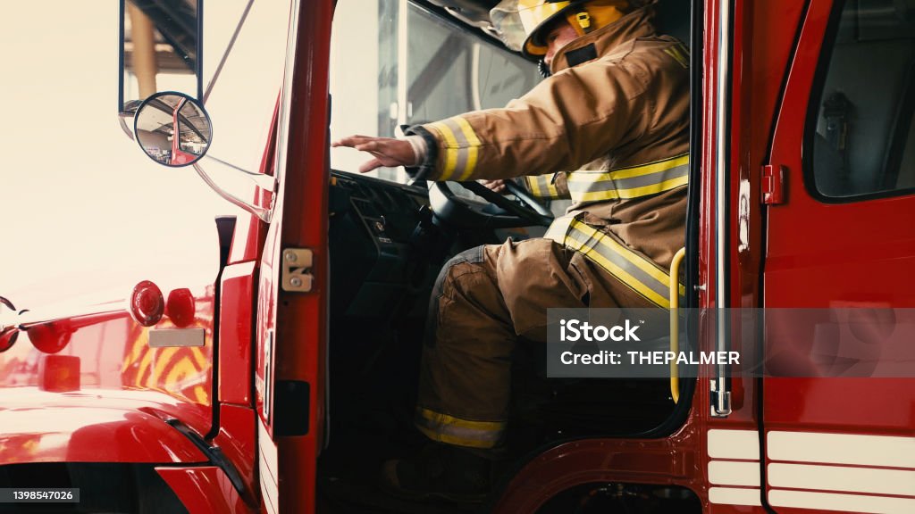 Firefighter about to close the door of his truck Navajo Firefighter about to close the door of his truck Firefighter Stock Photo