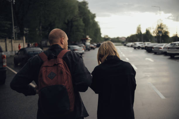 istock the lovers are coming. view from the back. the guy has a backpack on his back 1398549757