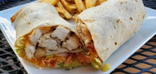Chicken wrap with French fries stock photo
