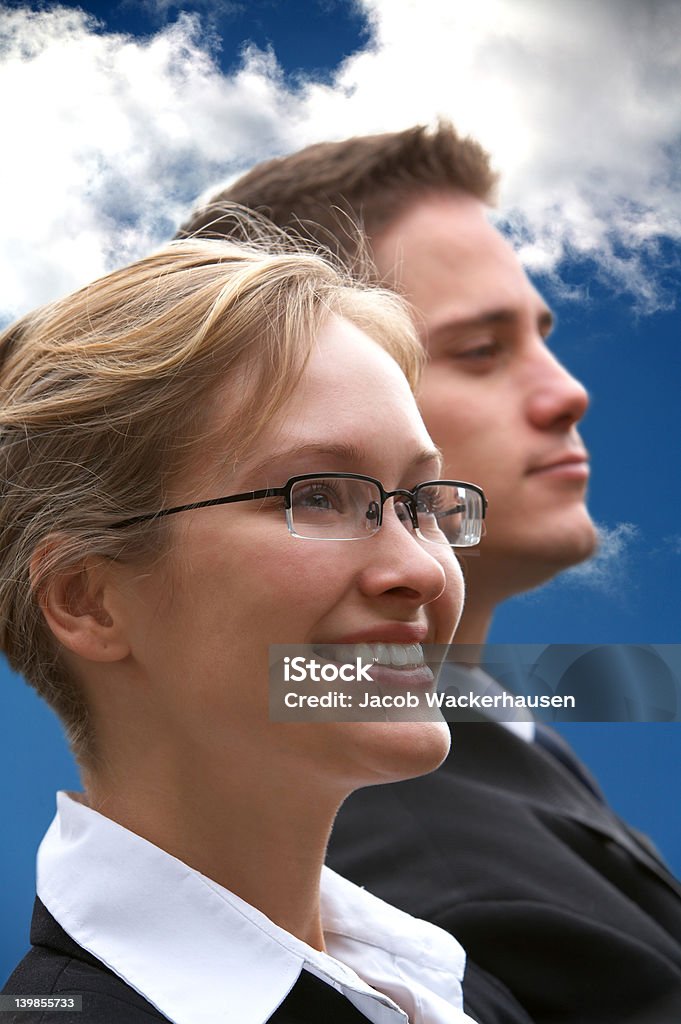 Young business rivals looking in different directions Contemplation Stock Photo