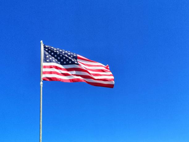 istock American flag blowing in the wind 1398559748