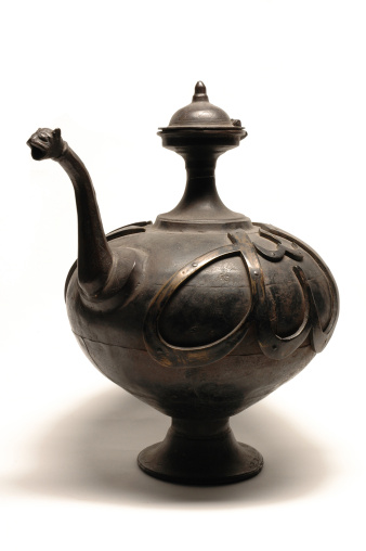 Antique iron teapot written Allah in arabic language