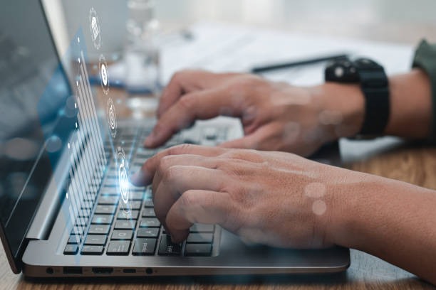 istock Businessman typing on laptop keyboard development and goals of work concept, working in office and wood table 1398562671