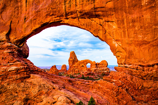 Looking through Tower Arch in the Klondike Blufs area of Arches National Park, Utah.