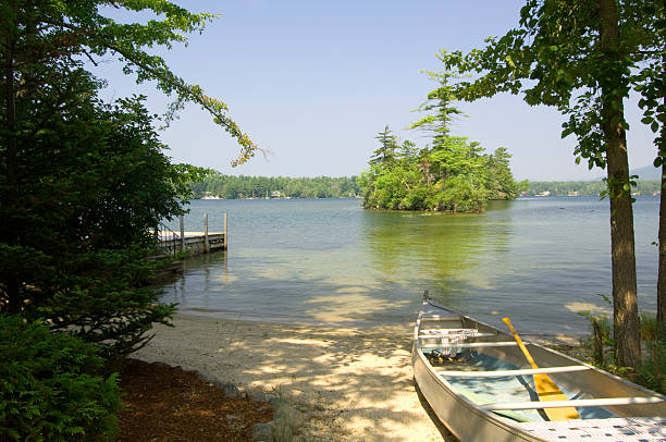 Secluded cove with canoe stock photo