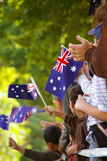 istock Group of people waving small Australian flags 139856829