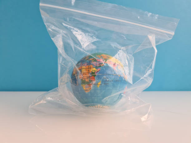 istock Planet earth in plastic bag environmental problem greenhouse effect and pollution 1398569345