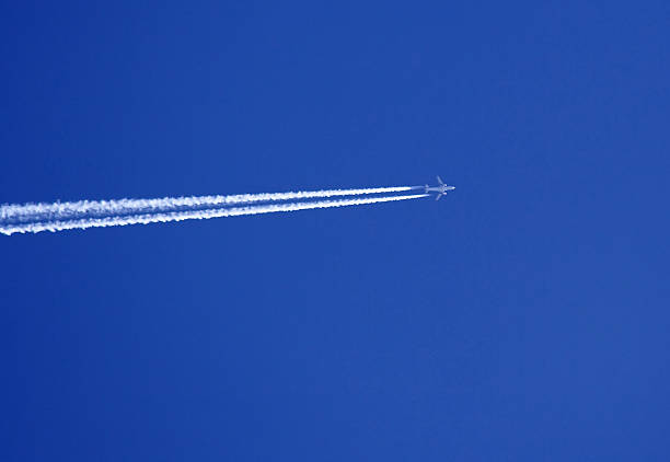 istock Vapor trail from jet aircraft against a deep blue sky. 139856951