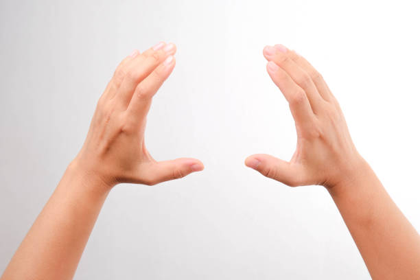 istock Female hand gesture holding something isolated on white background. 1398575745