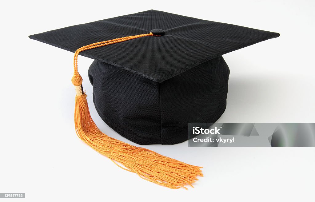 Graduation cap with yellow tassel isolated on white Graduation cap. Isolated object. Mortarboard Stock Photo