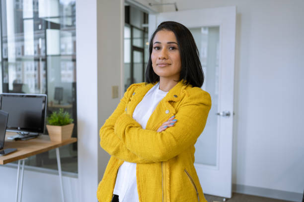 istock Business woman at the office looking at camera 1398578055