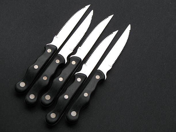 istock Classic Serrated Steak Knives on Black 139858107