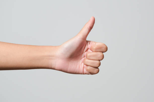 istock hand thump up sign isolated on white background 1398588960