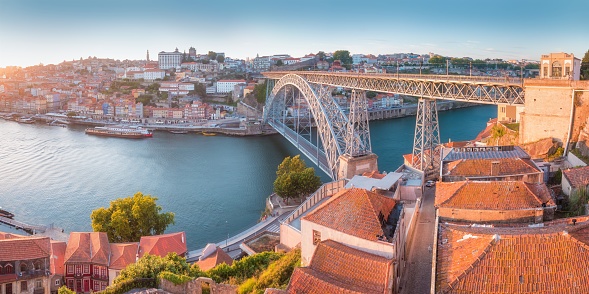 Porto Aerial Cityscape with Luis I Bridge and Douro River at Amazing Sunset, Portugal. Summer season.