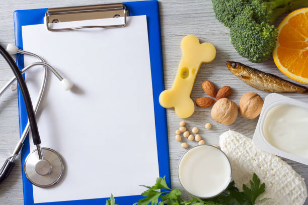 istock Bone shaped cheese, notebook, stethoscope and bone strengthening foods products, concept osteoporosis and prevention 1398595583