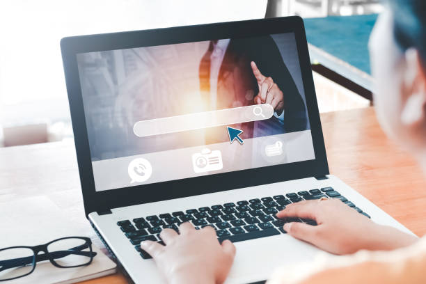 istock Asian lady browsing work opportunities online using job search computer app,looking for new vacancies on website page at laptop screen,  recruitment concept, rear close up view. 1398597984