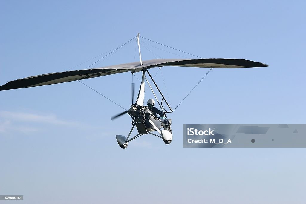 Ultralight take-off Ultralight taking off from an unmanned airfield in South Africa in the early morning.  Adventure Stock Photo