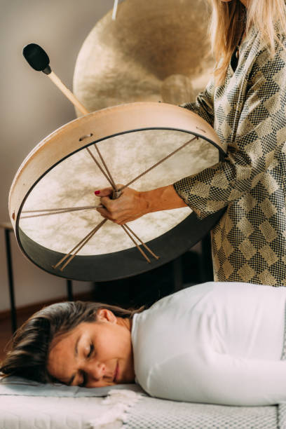 istock Sound Therapy Drum. Playing Native American Hide Drum In Sound Healing Therapy 1398604045