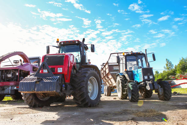 Agricultural machinery, tractors and equipment outdoors, near the garage, ready to work in the field. Agricultural machinery, tractors and equipment outdoors, near the garage, ready to work in the field. agricultural machinery stock pictures, royalty-free photos & images
