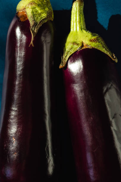 Close-up of two eggplants.