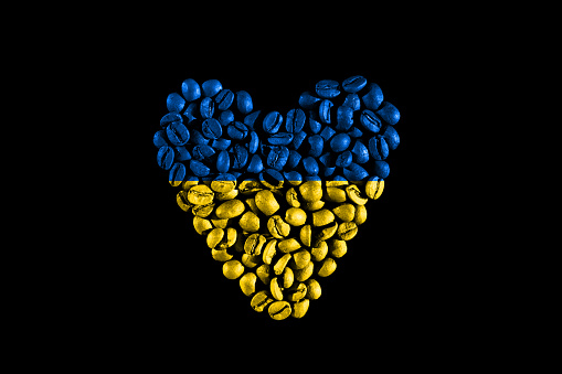 Ukraine textured flag in heart shape on black. flag of Ukraine. flag of Ukraine in the shape of a heart made of coffee beans.