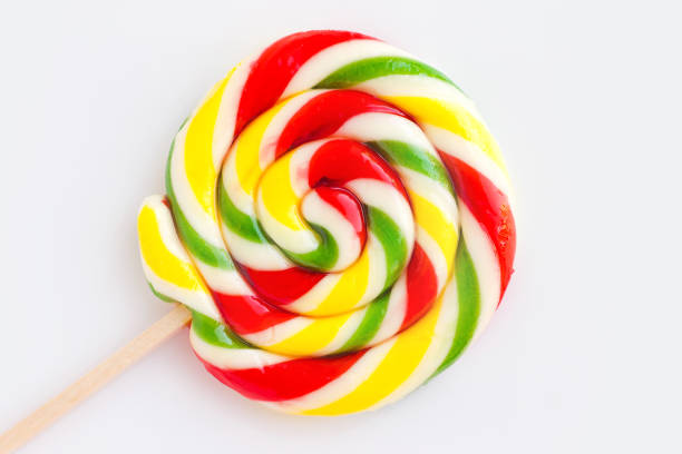 Classic  twisted spiral red and white lollipop on wooden stick isolated