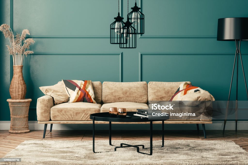 Bohemian Style Living Room Design Bohemian style living room with warm color furniture and green wall. Coffee Table Stock Photo