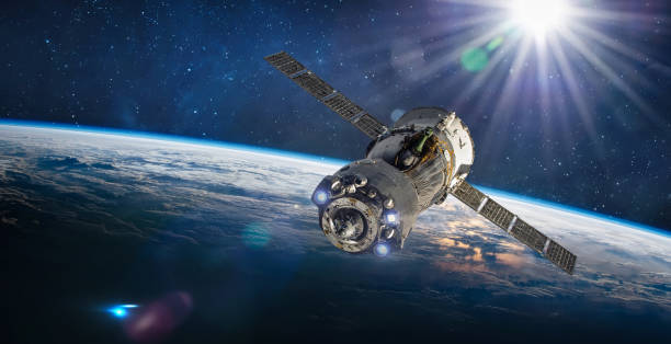 istock Spaceship on orbit of Earth. Space craft with cosmonauts in outer space. Sci-fi wallpaper. Elements of this image furnished by NASA 1398609570