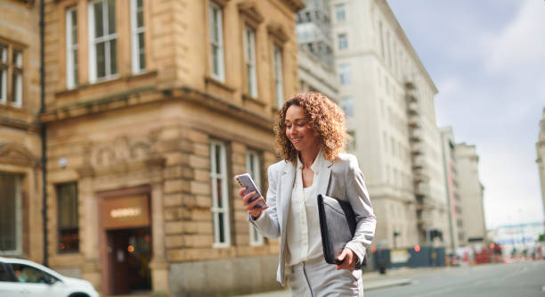 great news by phone young woman gets the news by phone liverpool one stock pictures, royalty-free photos & images