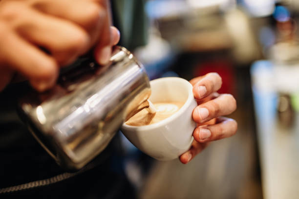 istock Bartender working behind the bar and preparing delicious coffee 1398612096