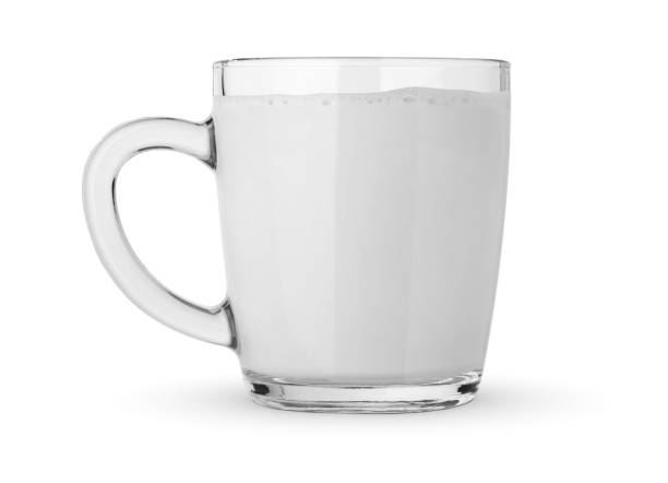 istock Glass of milk isolated on white 1398613111