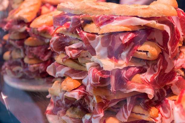 istock Iberian ham sandwiches stacked behind window display 1398615993